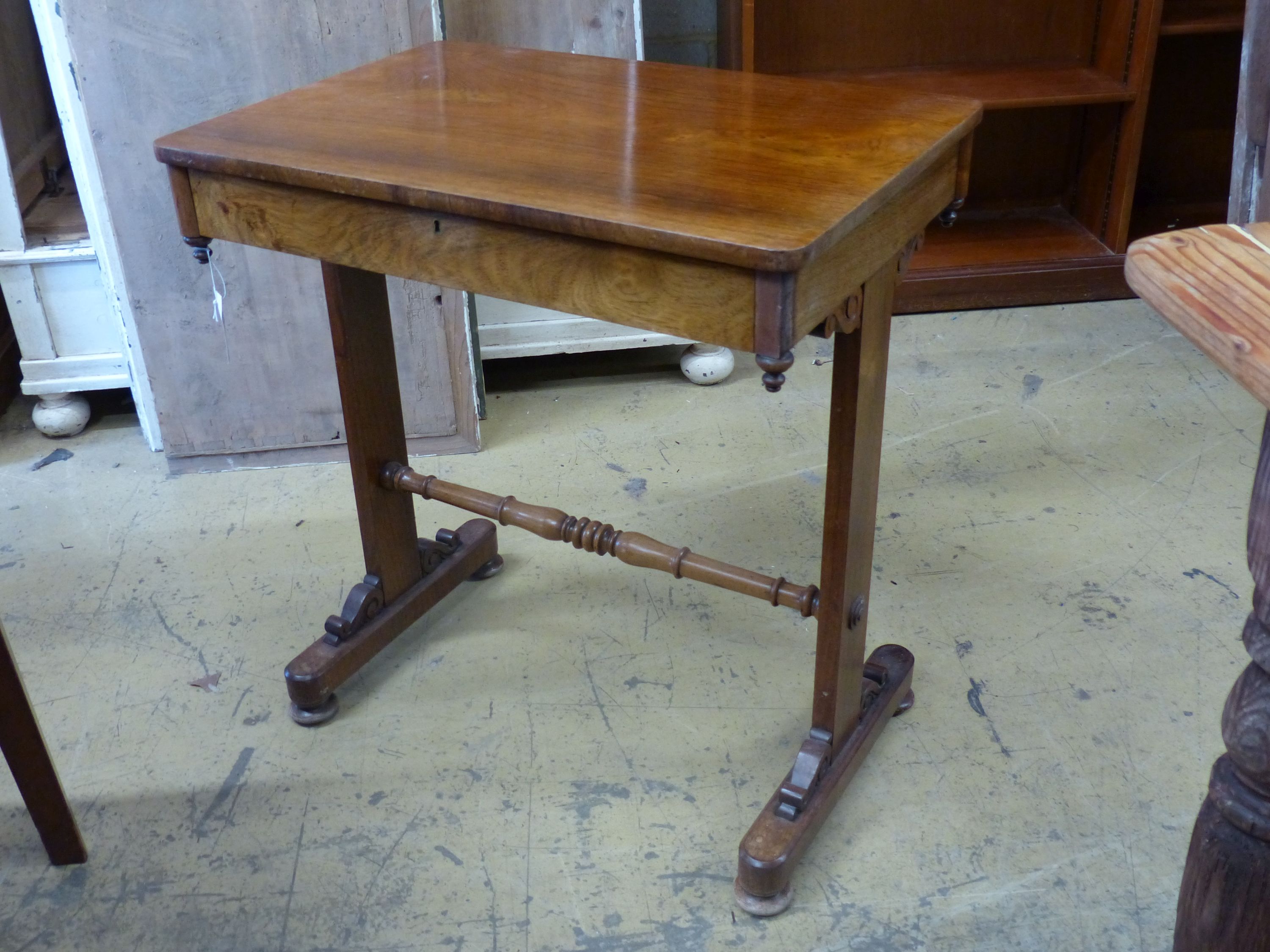 A Victorian rosewood side table, on end standard supports, width 66cm, depth 45cm, height 72cm